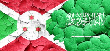 Burundi bayrağı bir grunge Suudi Arabistan bayrağı ile duvar kırık
