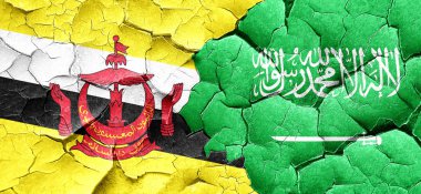 Brunei bayrağı bir grunge Suudi Arabistan bayrağı ile duvar kırık
