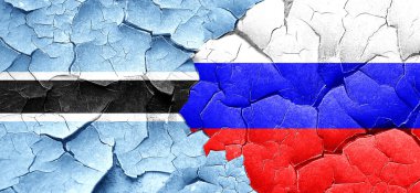 Botsvana bayrağı bir grunge Rusya bayrağı ile duvar kırık