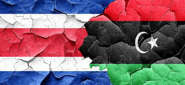 Costa Rica vlajku vlajku Libye grunge popraskané zdi — Stock fotografie