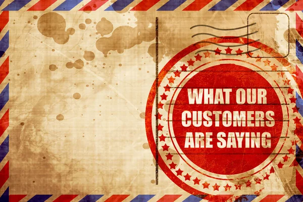 Lo que nuestros clientes están diciendo, sello grunge rojo en una ba de correo aéreo — Foto de Stock