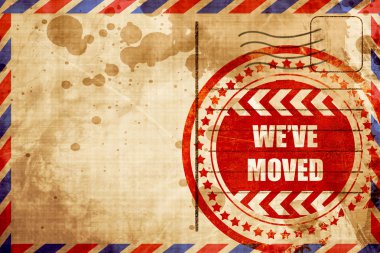Weve moved sign, red grunge stamp on an airmail background