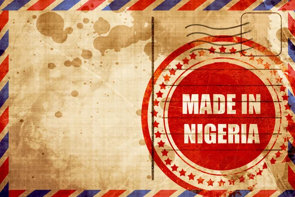 Feito em nigeria, selo grunge vermelho em um fundo de correio aéreo — Fotografia de Stock