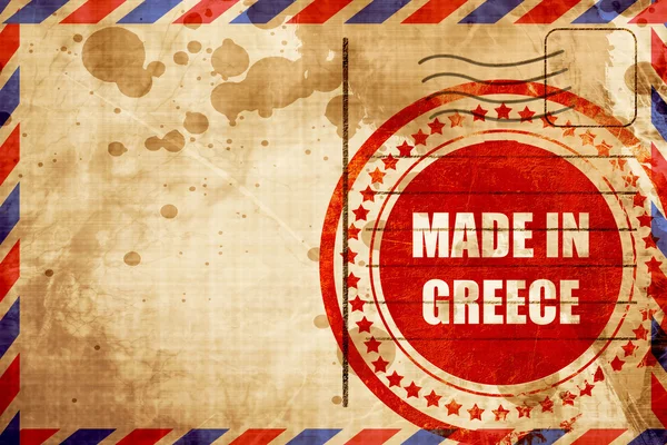 Gefertigt in Griechenland, roter Grunge-Stempel auf Luftpost-Hintergrund — Stockfoto