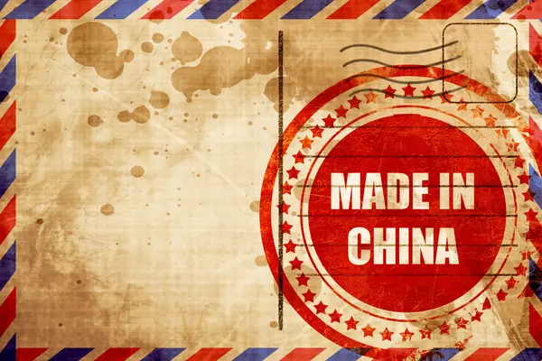 Fabriqué en Chine, timbre grunge rouge sur fond de poste aérienne — Photo