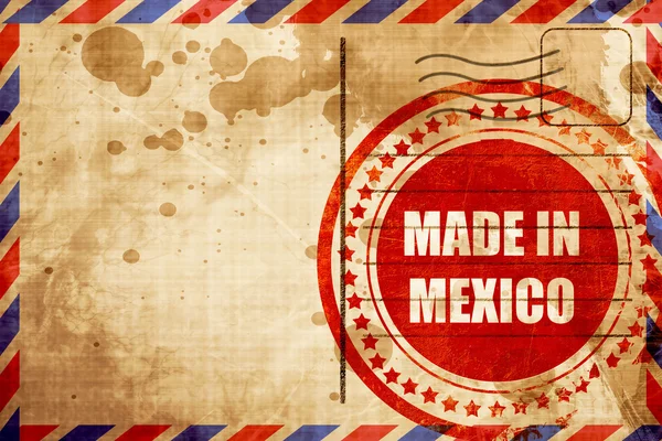 Hecho en México, sello grunge rojo sobre un fondo de correo aéreo — Foto de Stock