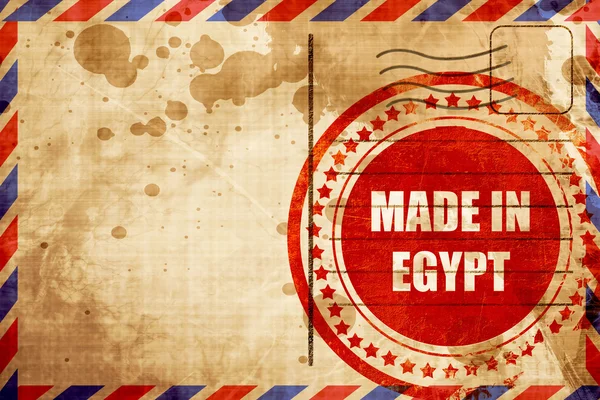 Tillverkad i Egypten, röda grunge stämpel på en flygpost bakgrund — Stockfoto