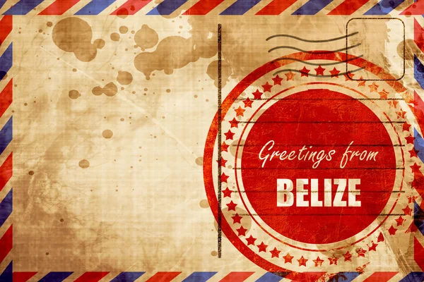 Üdvözlet Belize, piros grunge bélyeg egy légiposta háttér — Stock Fotó