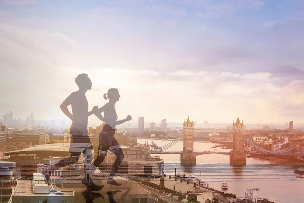 Två löpare och panoramautsikt över London — Stockfoto