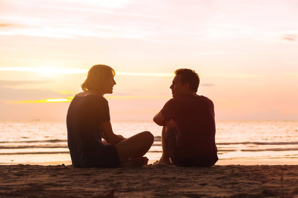 man and woman on the beach