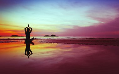 Yoga silhouette at sunset clipart
