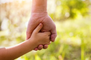 Father and child holding hands clipart