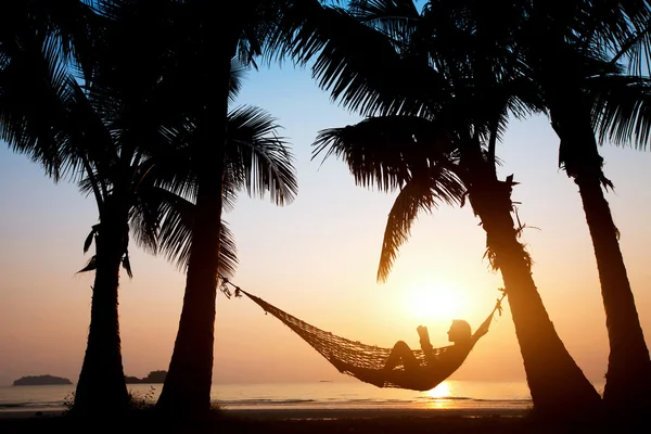 Woman in hammock on the beach — Stock Photo, Image