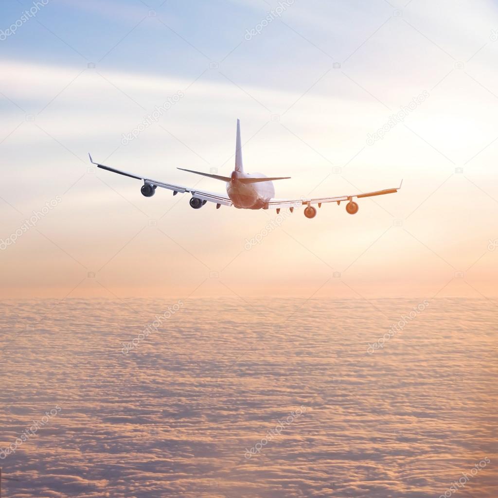 Airplane above the clouds