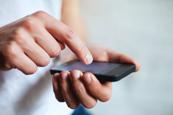 Hands holding smart phone