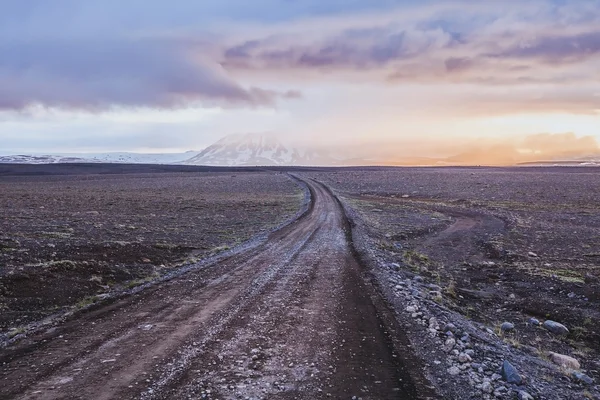 Dirt road in volcanic desert — Stock Photo, Image