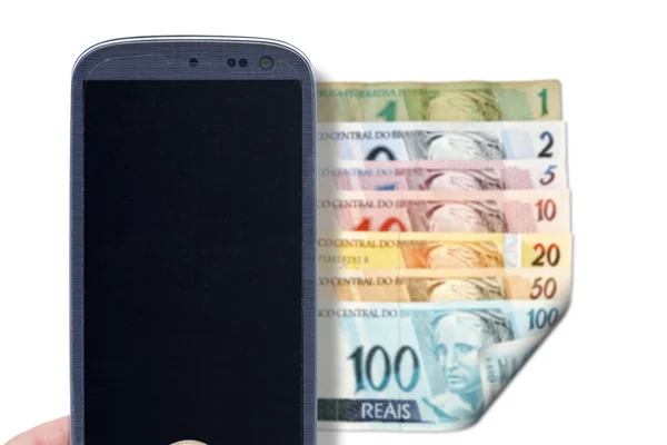 Smartphone and Brazilian bills - Front — Stock Photo, Image