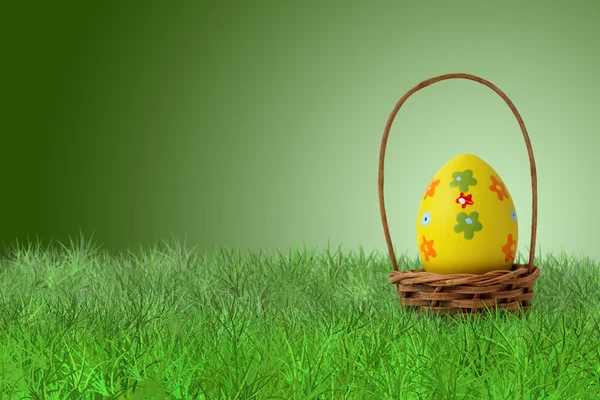 Painted Easter egg in a basket — Stock Photo, Image