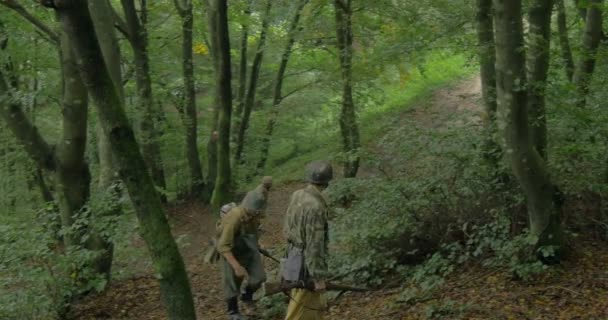 A patrol of German soldiers during a WWII reenactment — Stock Video