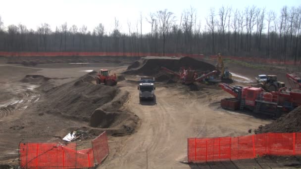 Excavators and construction machinery at a construction site — Stock Video