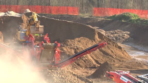 Excavators and construction machinery at a construction site — Stock Video