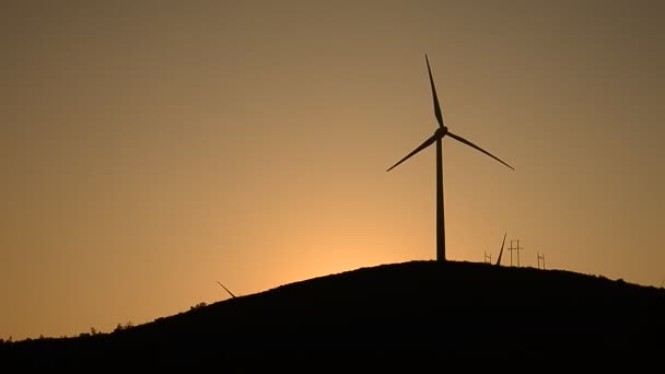 Wind turbines in the country side at evening — Stock Video