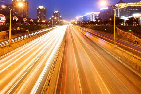 Economisch autoverhuur in highway with blur motion — Stockfoto