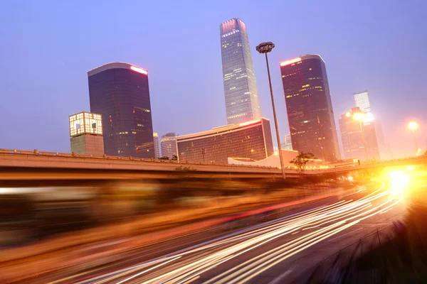 The light trails on the modern building background in shanghai china — Stock Photo, Image