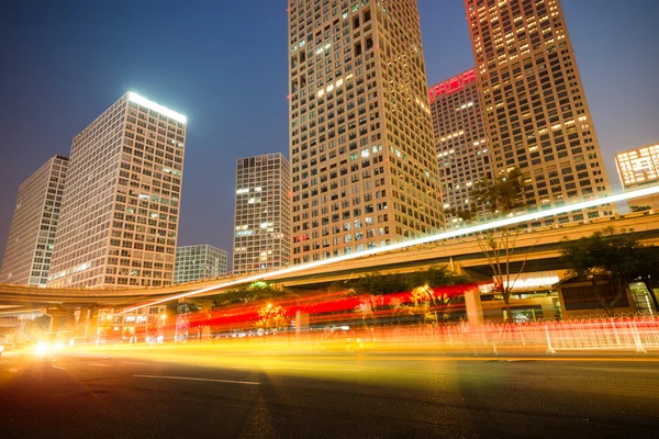 The light trails on the modern building background in shanghai china — Stock Photo, Image