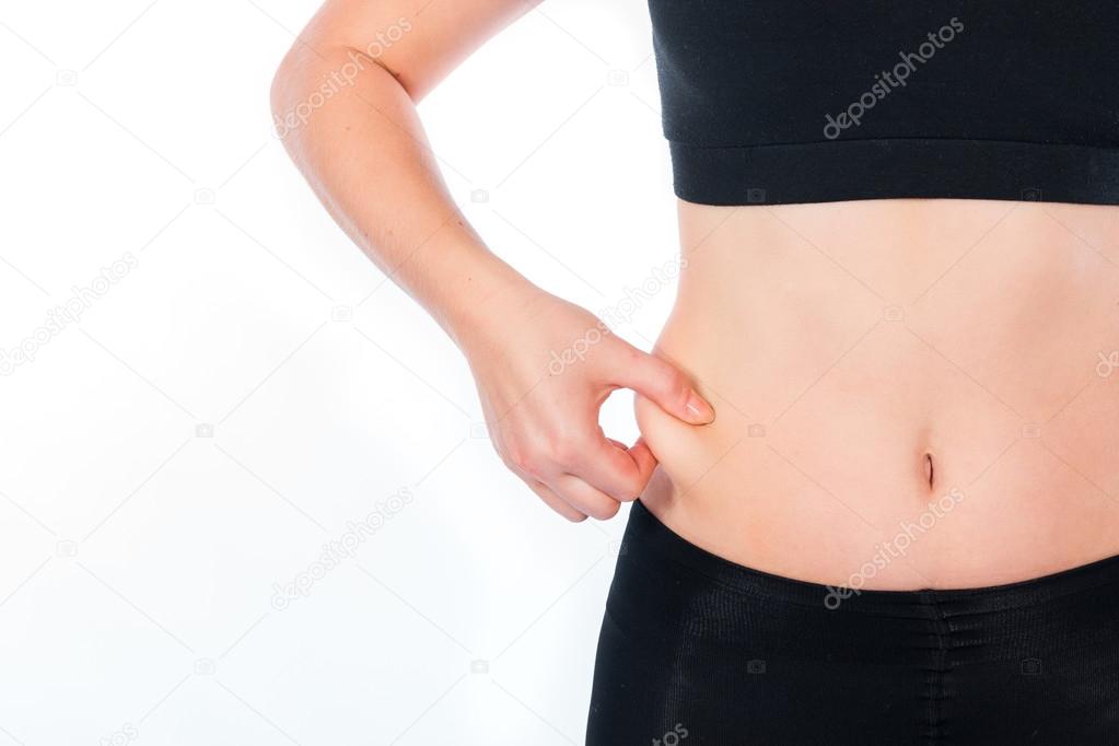 Fat female belly holding or pinching fat on white background
