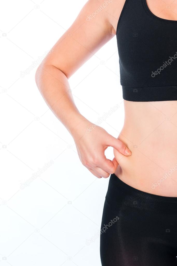 Fat female belly holding or pinching fat on white background