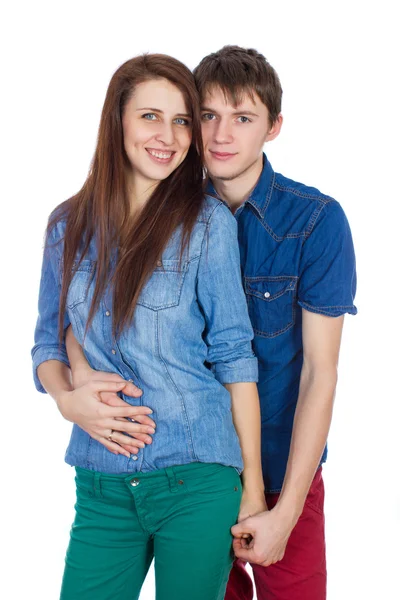 Beautiful young smiling couple hugging — Stock Photo, Image