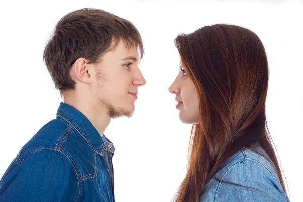 Beautiful and young loving couple, standing opposite each other — Stock Photo, Image