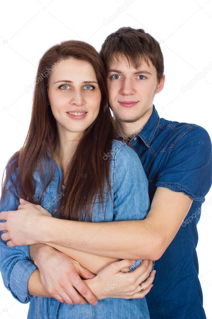 Beautiful young smiling couple hugging