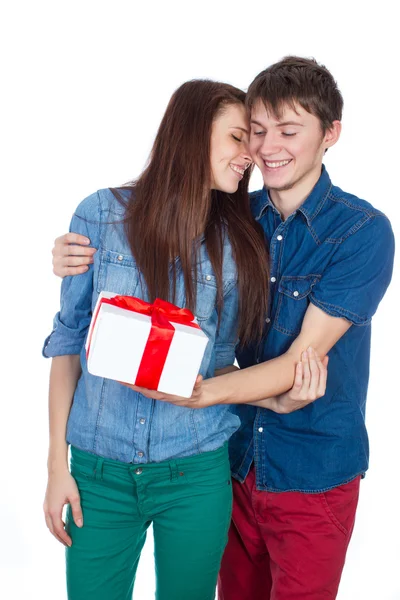 Happy Man giving a gift to his Girlfriend. Happy Young beautiful Couple  isolated on a White background. — Stock Photo, Image