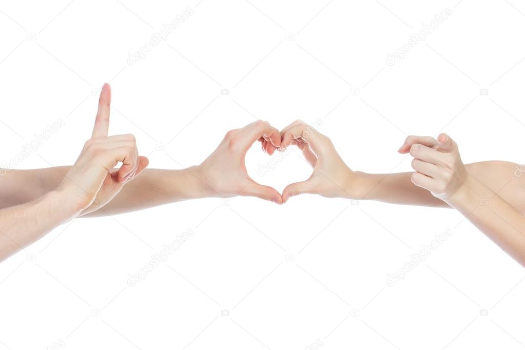 Valentine Couple in love showing Heart with their fingers. Love Concept.