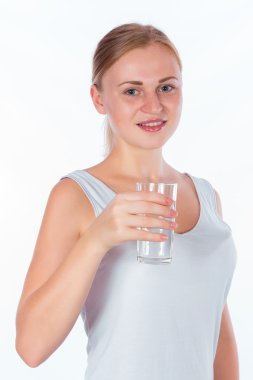young happy girl holding a glass of water