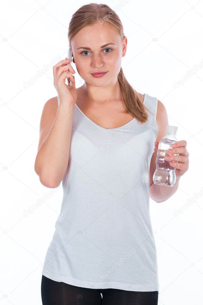 young happy girl holding a bottle of water