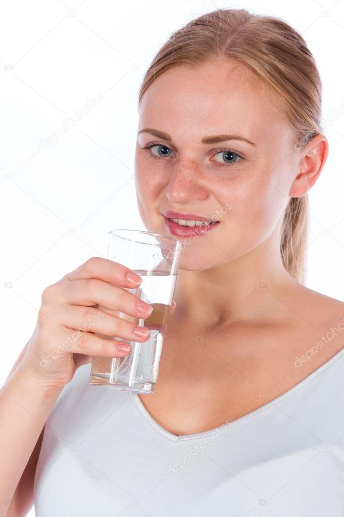 young girl drink water from glass