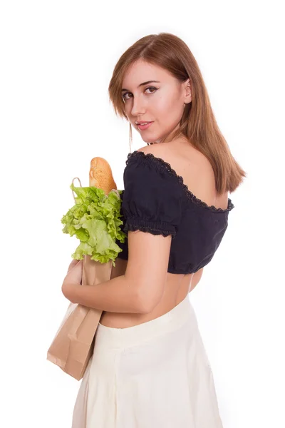 Junge Frau mit braunem Beutel mit gesundem Essen und Gemüse — Stockfoto