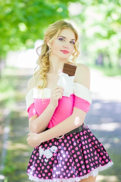 Portrait of a chocolate loving young blonde beauty — Stock Photo, Image