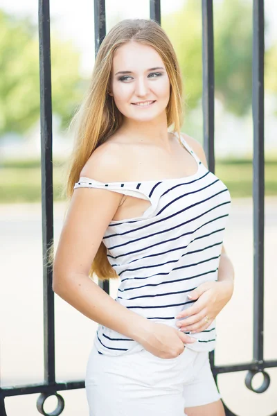 Stylish blonde smiling at camera — Stock Photo, Image