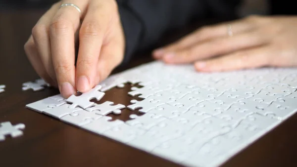 Hand Pick Piece Jigsaw Connect Success Wooden Table Top Selected — Stock Photo, Image