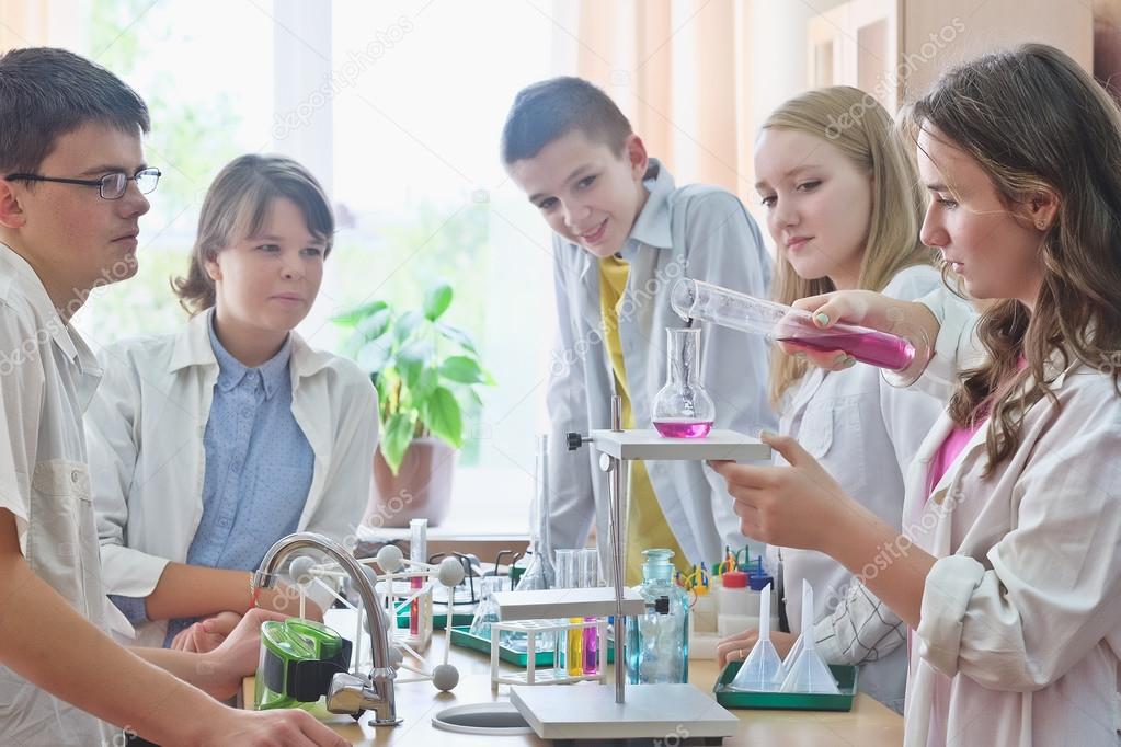 Schoolchildren  in science class