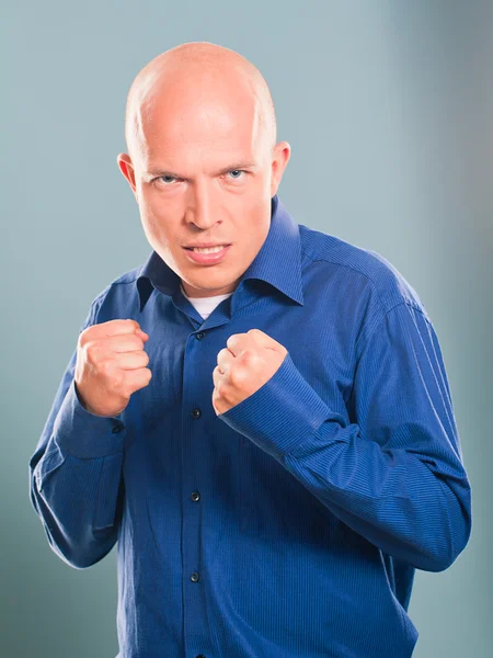 Handsome bald  man wearing blue skirt — Stock Photo, Image