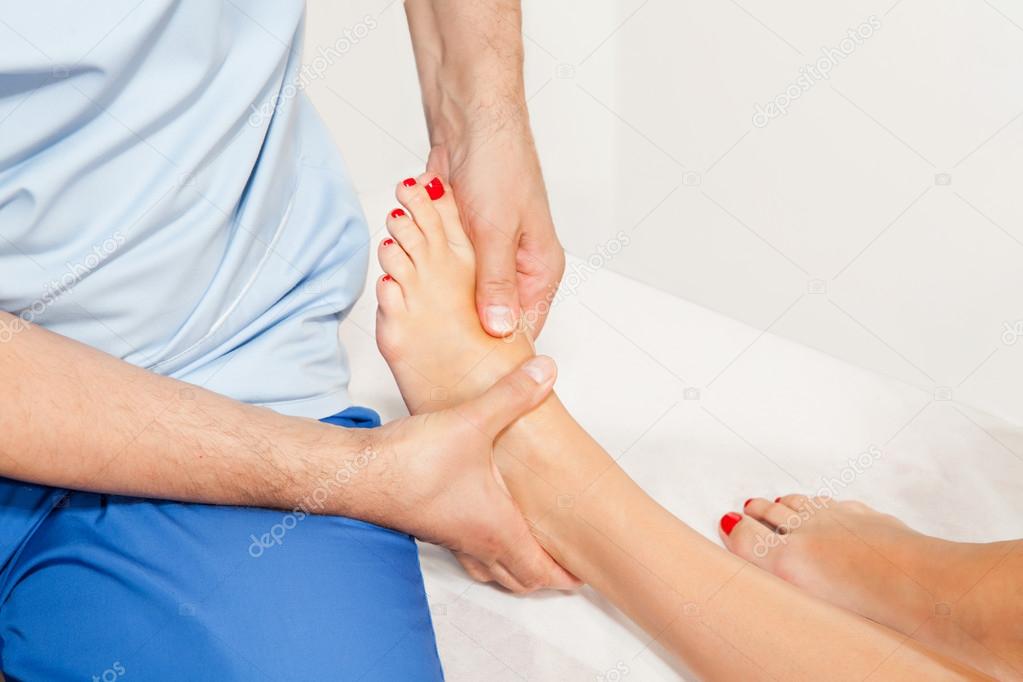 Doctor orthopedist examining feet