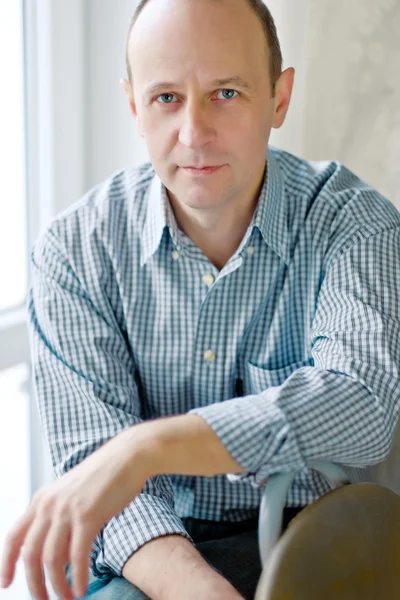 Portrait of smart bald man wearing a striped shirt — Stock Photo, Image