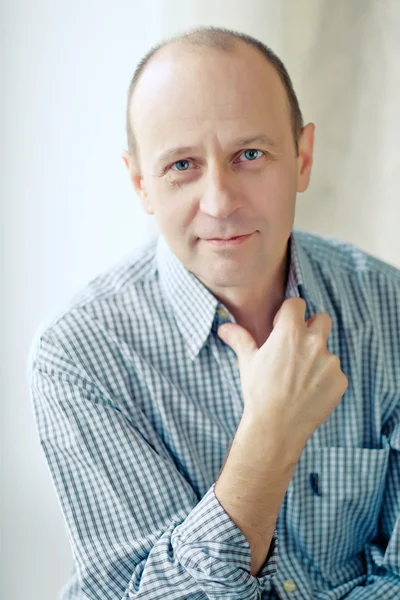 Portrait of smart bald man wearing a striped shirt — Stock Photo, Image