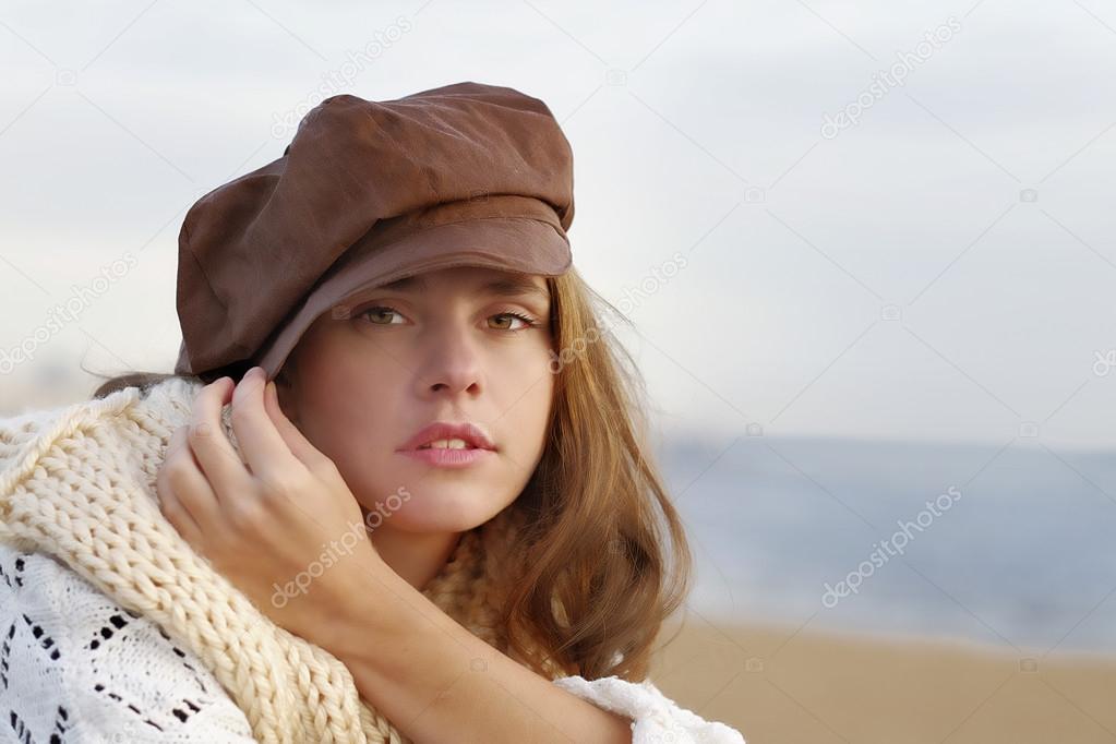 Young woman wearing brown kepi