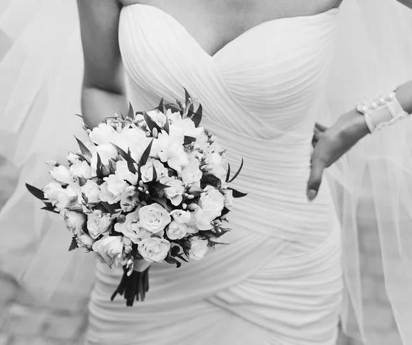 Young bride with bouquet.
